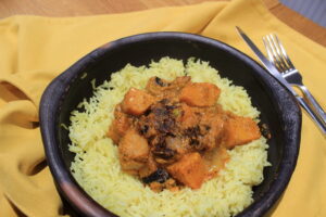 Bowl of cashew nut and black pepper curry served with rice