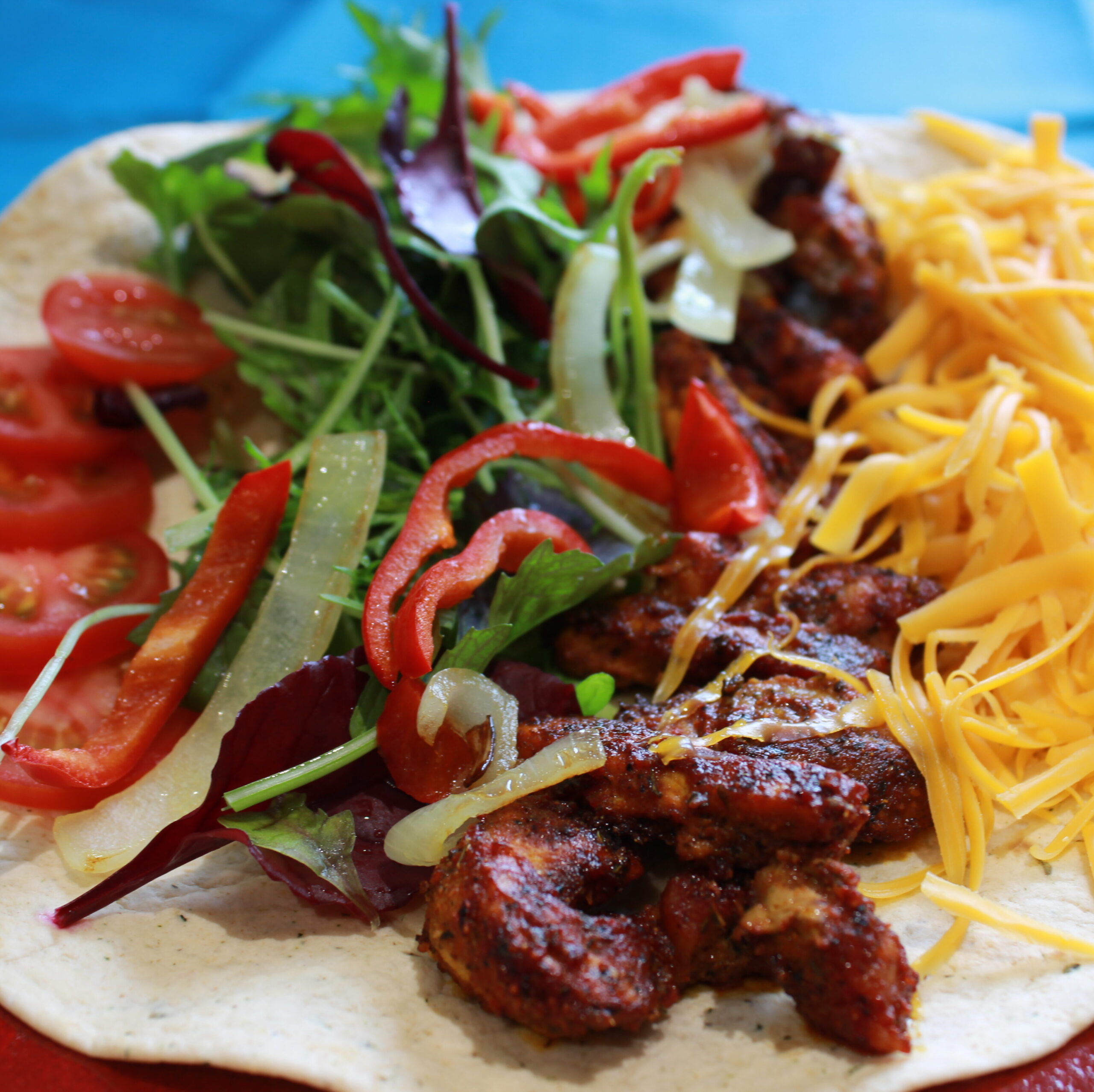 Lunch idea number 3. Wrap with chicken coated in a Case for Cooking spice rub, pepper, onions, salad and grated cheese.